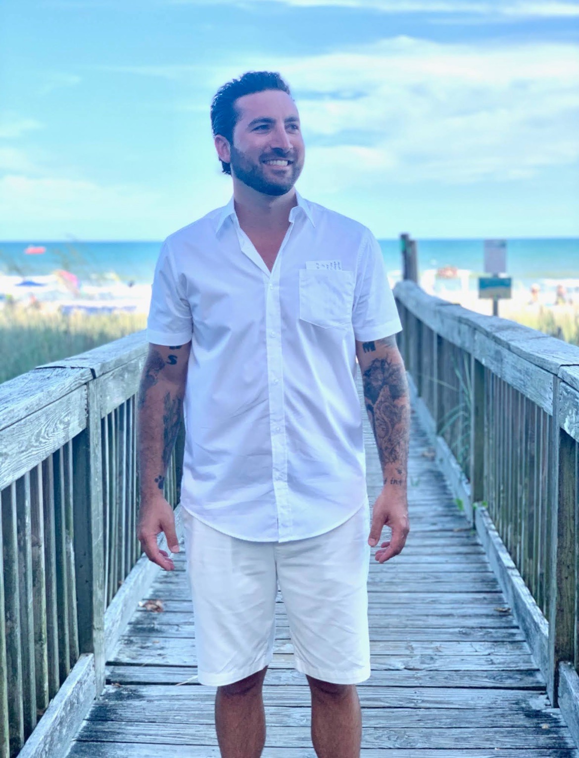 Photo of Dr. Thrush standing on a beach boardwalk